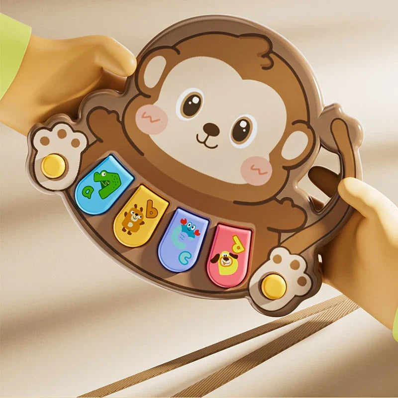 Brown monkey-shaped kids electronic piano toy with colorful letter and animal buttons for piano toy learning and baby toys multifunctional use
