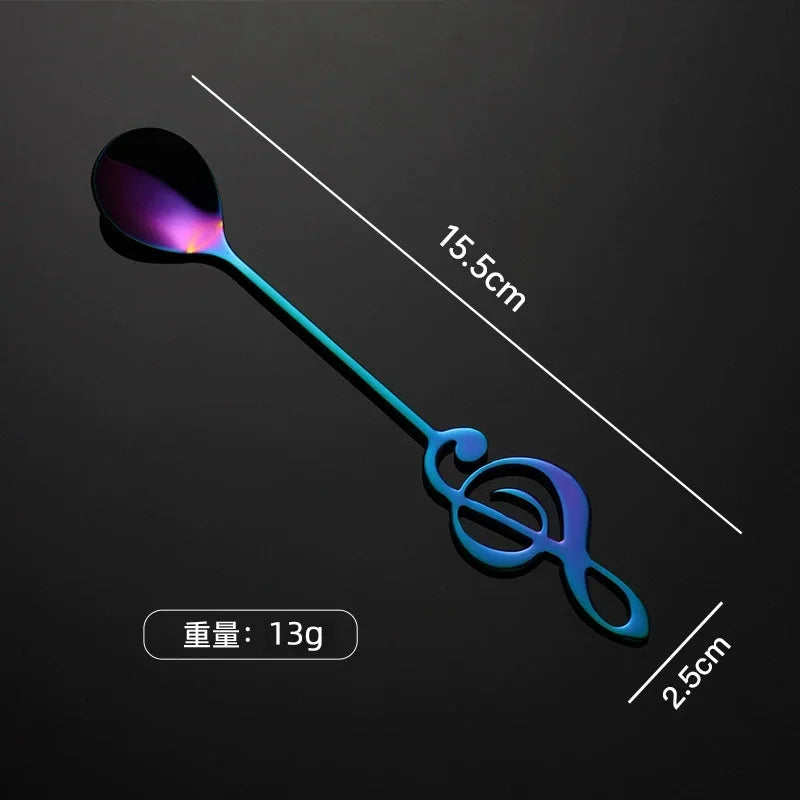 A sleek iridescent stainless steel mug teaspoon with a treble clef musical note handle for ice cream creative use
