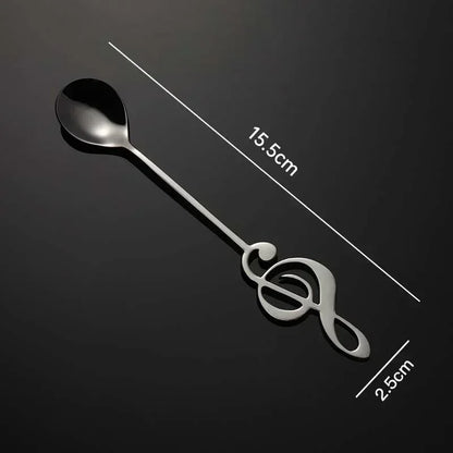 A sleek black stainless steel musical note spoon with treble clef design ideal for mug teaspoons music and ice cream creative use