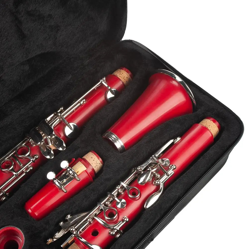Red naomi abs clarinet bb cupronickel with silver keys in a black case with cork-lined mouthpiece and screwdriver woodwind instrument