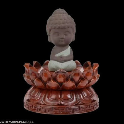 A serene light gray stone buddha figurine with closed eyes meditates on a solid wood lotus woodcarving buddha guanyin pedestal