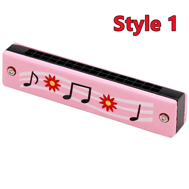 Pink wooden harmonica musical instrument with black reed plates and red flower designs for toys music teaching and early education