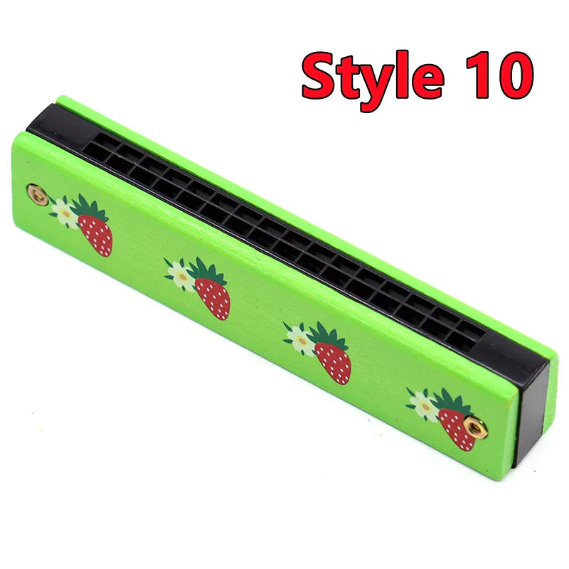 Bright green wooden harmonica musical toy with red strawberry and white flower decals for puzzle early education