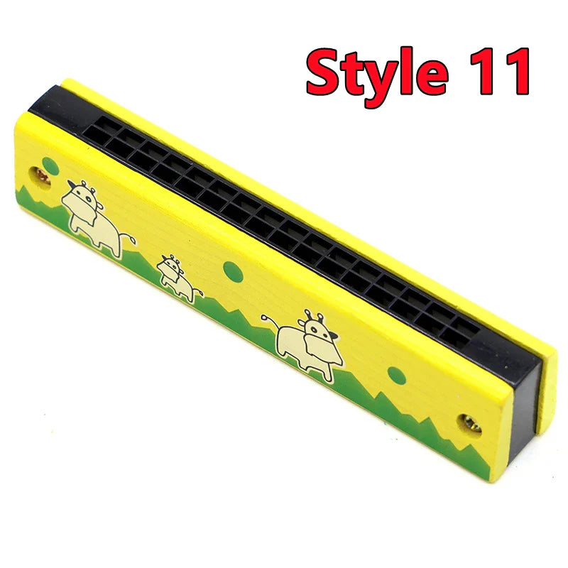 Yellow plastic harmonica with black reed plate and cartoon cow illustrations for toys music teaching and puzzle early education
