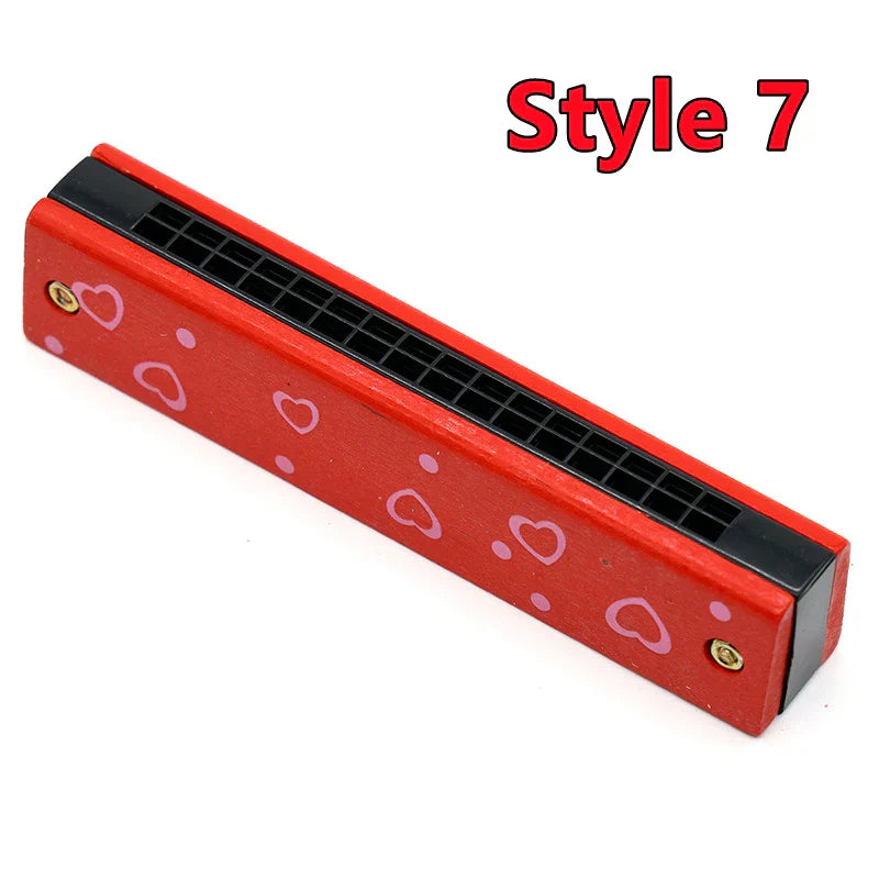 Red wooden harmonica musical instrument with pink heart decals and black mouthpiece for toys music teaching and puzzle early education
