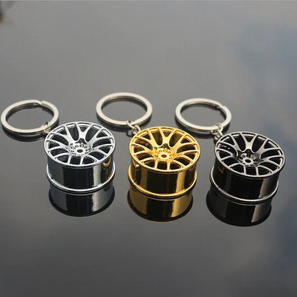 Three miniature alloy wheel rim keychains in silver gold and black finishes metal hub key chain car key ring gift