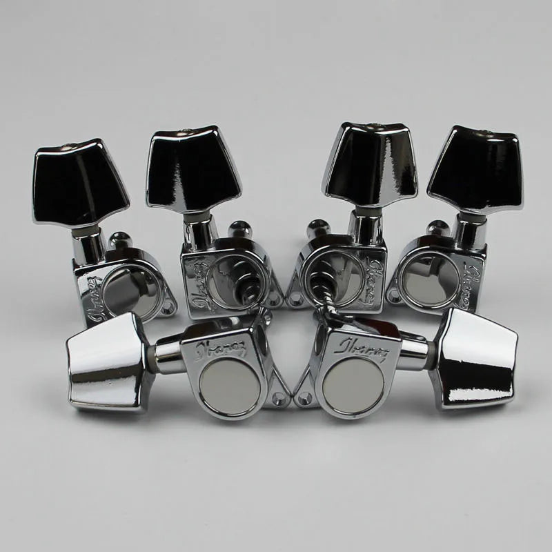 Chrome finished ibanez acoustic guitar tuning machines with black square knobs shown from the back side