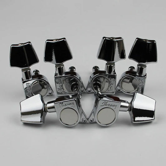 Chrome finished ibanez acoustic guitar tuning machines with black square knobs shown from the back side