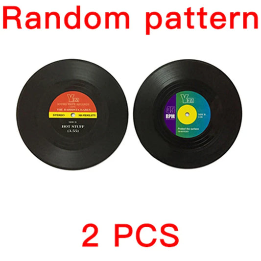 Two black retro vinyl record cup coasters with colorful patterned labels heat resistant music drink mats