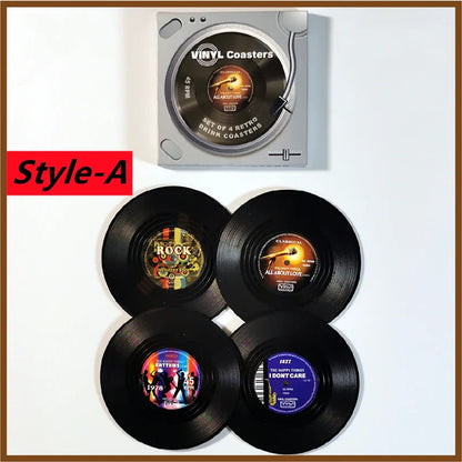 Set of four colorful retro vinyl record cup coasters with heat resistant music labels in silver turntable-style packaging