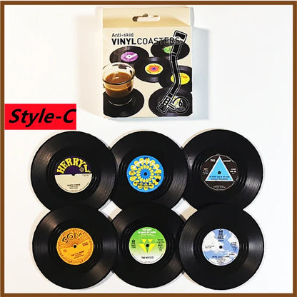 Set of six black retro vinyl record cup coasters with colorful vintage labels heat resistant music drink mats