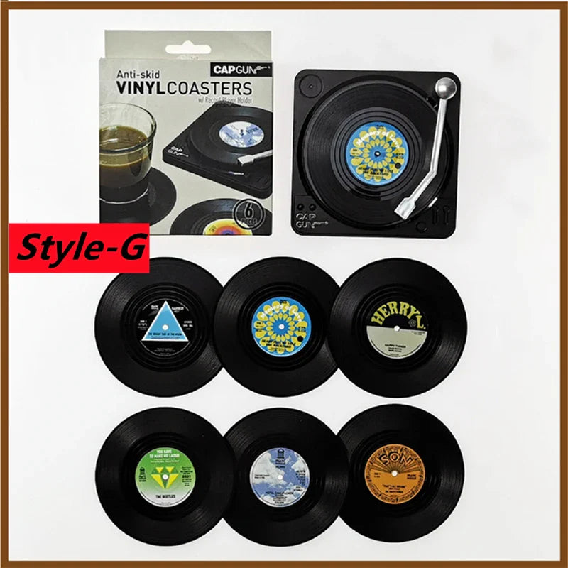 Black vinyl retro vinyl record cup coasters with colorful vintage labels and a turntable-shaped heat resistant music holder