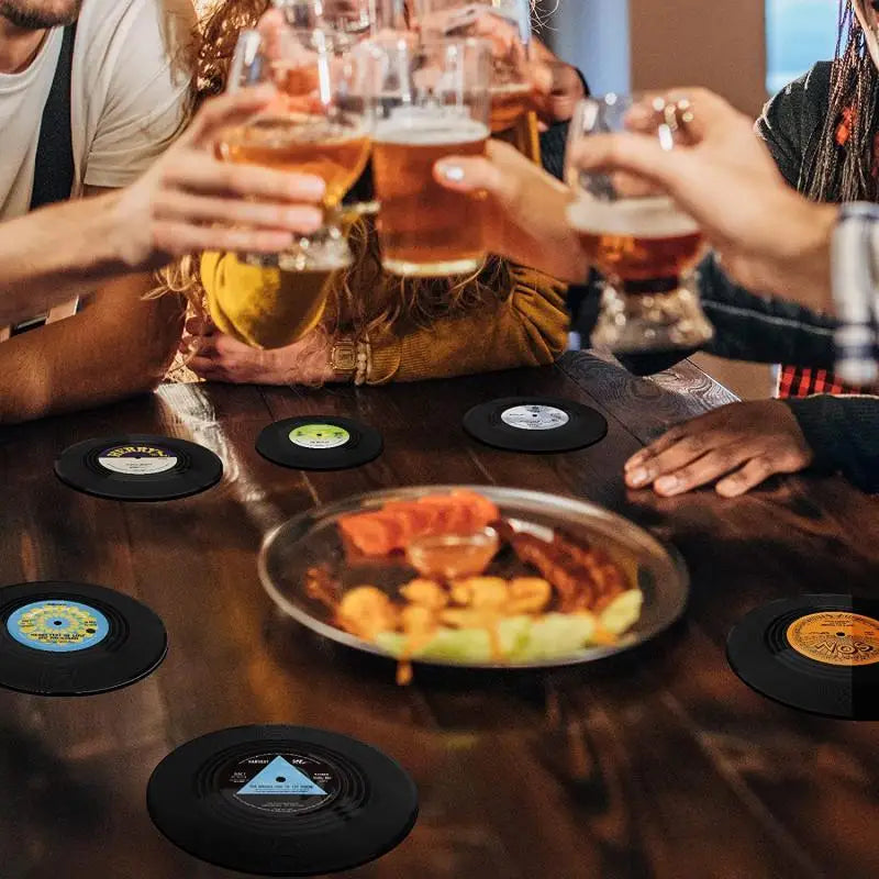 Black vinyl record cup coasters with colorful retro vinyl record labels, heat resistant music drink mug mats