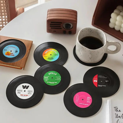 Set of six retro vinyl record cup coasters with colorful labels black rims heat resistant music drink mats