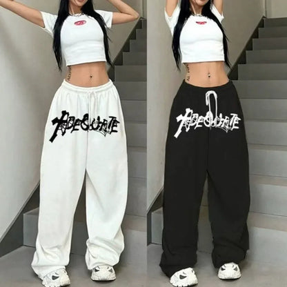 White and black wide leg high waist hip hop jazz sweatpants with abesurte print and drawstring waist