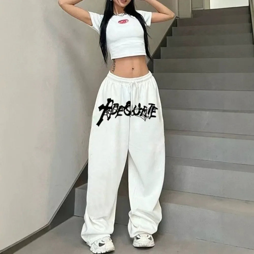 White high waist wide leg sweatpants with black graffiti style adequate lettering for hip hop jazz dance