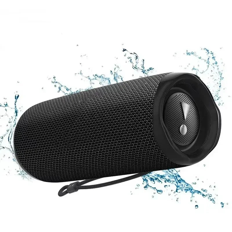 Black textured fabric portable outdoor subwoofer wireless speaker with sleek circular control panel and integrated lanyard