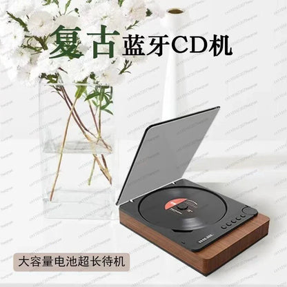 Vintage player bluetooth hi-fi music system with sleek black and wood-grain finish and circular disc slot