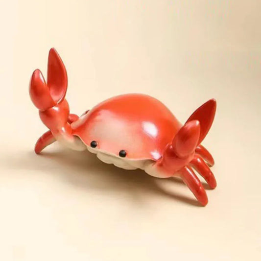 A glossy red ceramic creative crab muscle figurine with black bead eyes as a fun pen holder and stand home accessories