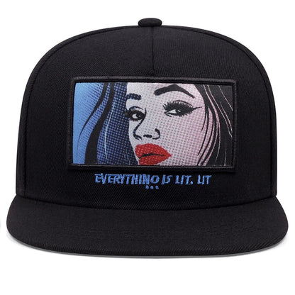Black snapback cap with red label featuring a rectangular embroidered pop-art woman portrait for outdoor use