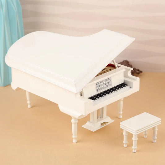 White handmade mini piano with black and white keys and detailed music sheet design as musical instrument polychrome gift