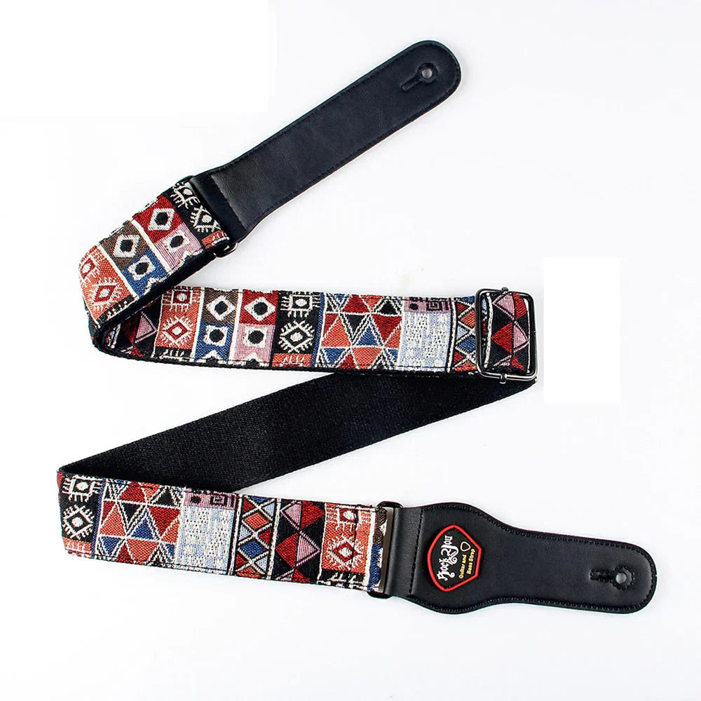 A black high quality cotton guitar strap with vibrant red blue white geometric pattern for bass guitar use