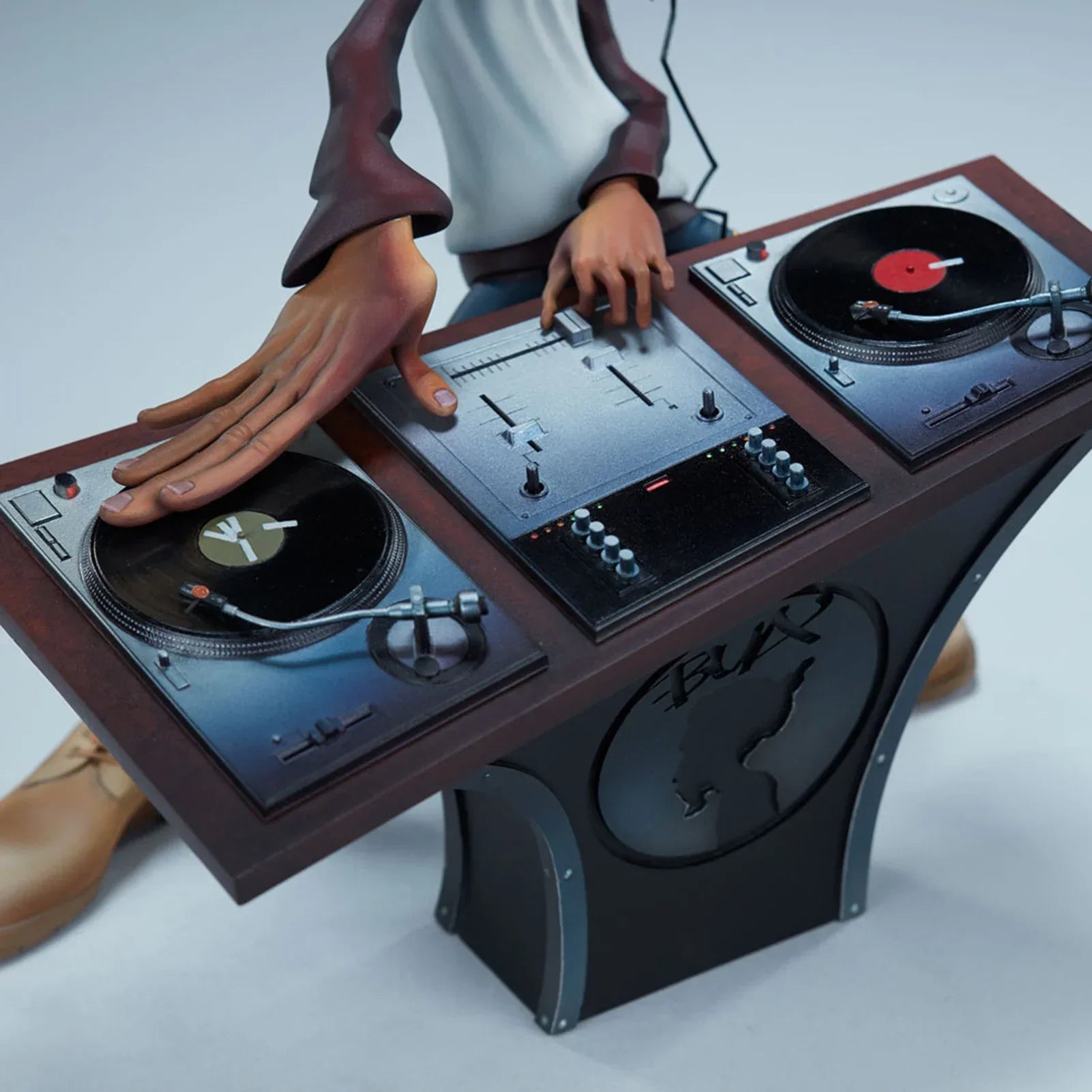 Detailed hiphop artist statue in resin featuring a dj break dance shape with brown hands at a turntable console