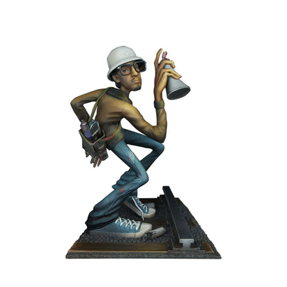 A detailed resin hiphop artist statue of a graffiti artist in white hard hat holding spray can blue jeans break dance shape