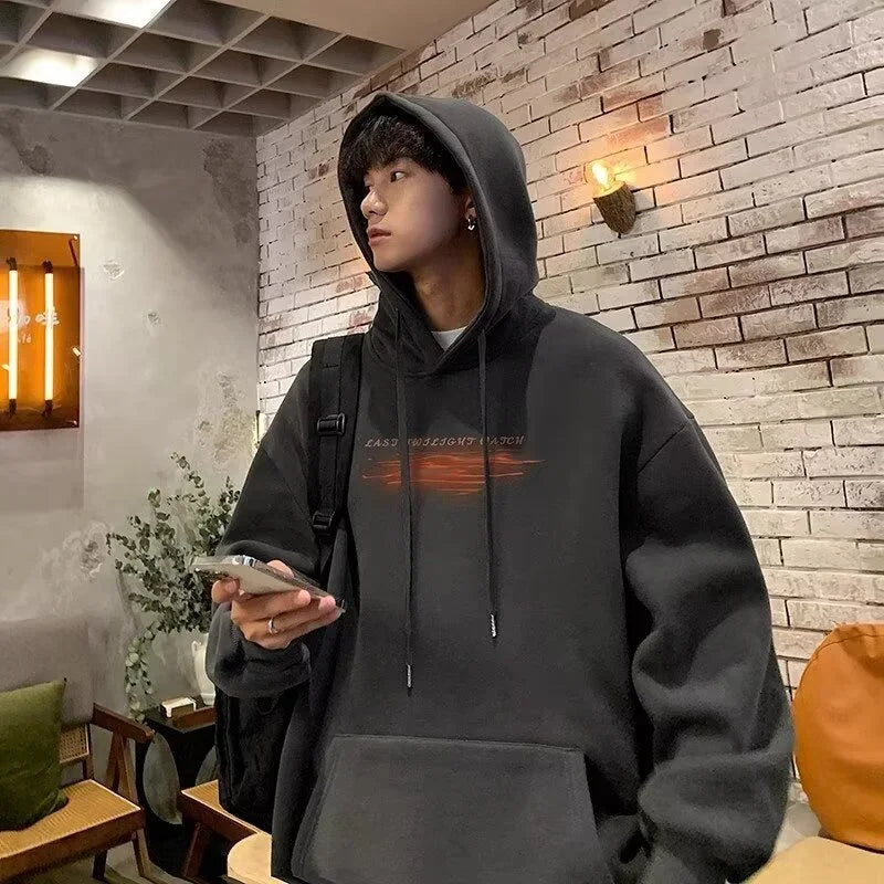 Black hip hop graphic pullover hoodie in cotton fleece vintage with faded orange design and matching drawstrings y2k streetwear
