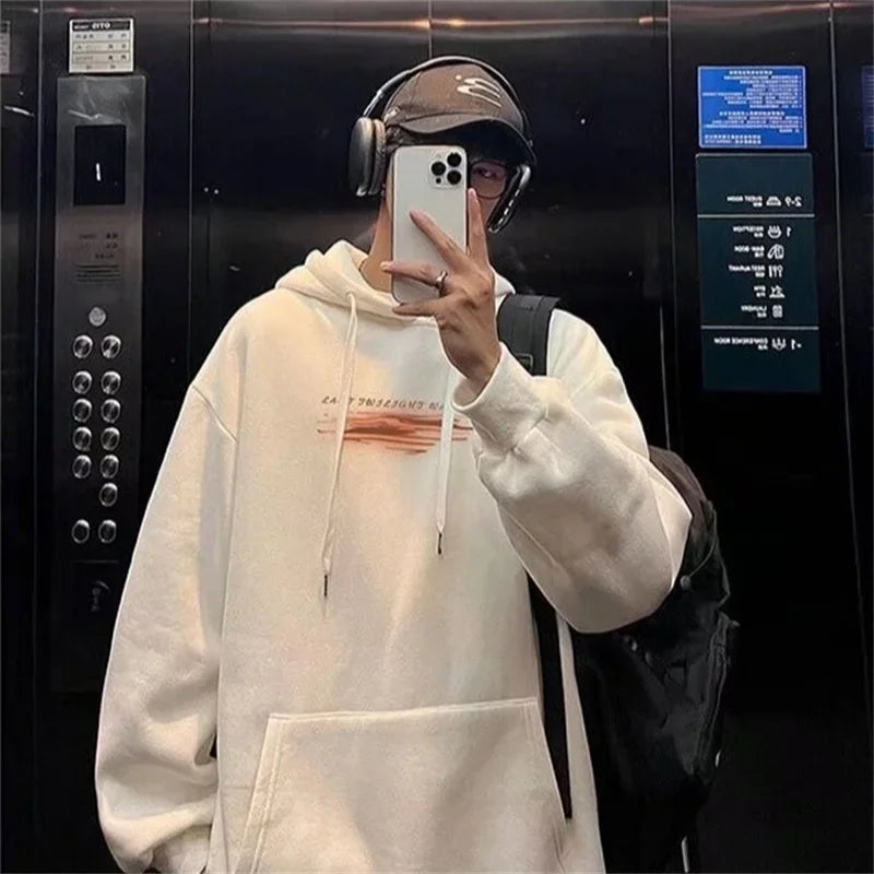 Cream-colored oversized cotton fleece hoodie with subtle horizontal graphic print recommended weight for streetwear use