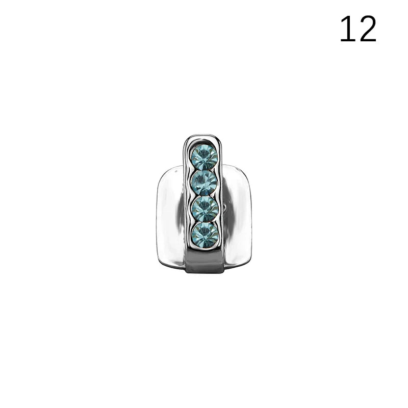 Silver-toned dental grills jewelry charm with four teal rhinestones in a sleek design for hip hop and cosplay use