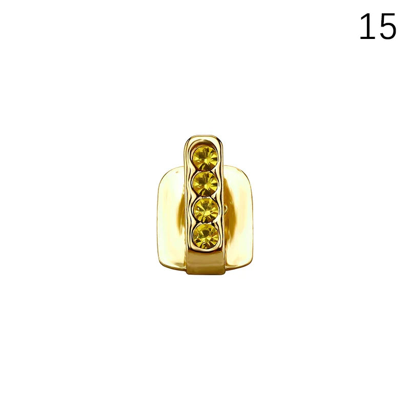 Gold-colored dental grills jewelry featuring four yellow gemstones in a vertical row for hip hop cosplay use