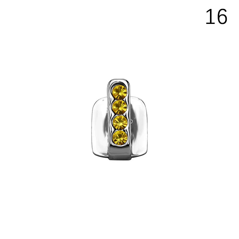 Silver-toned dental grills jewelry featuring four vertical yellow crystals for hip hop style and cosplay use