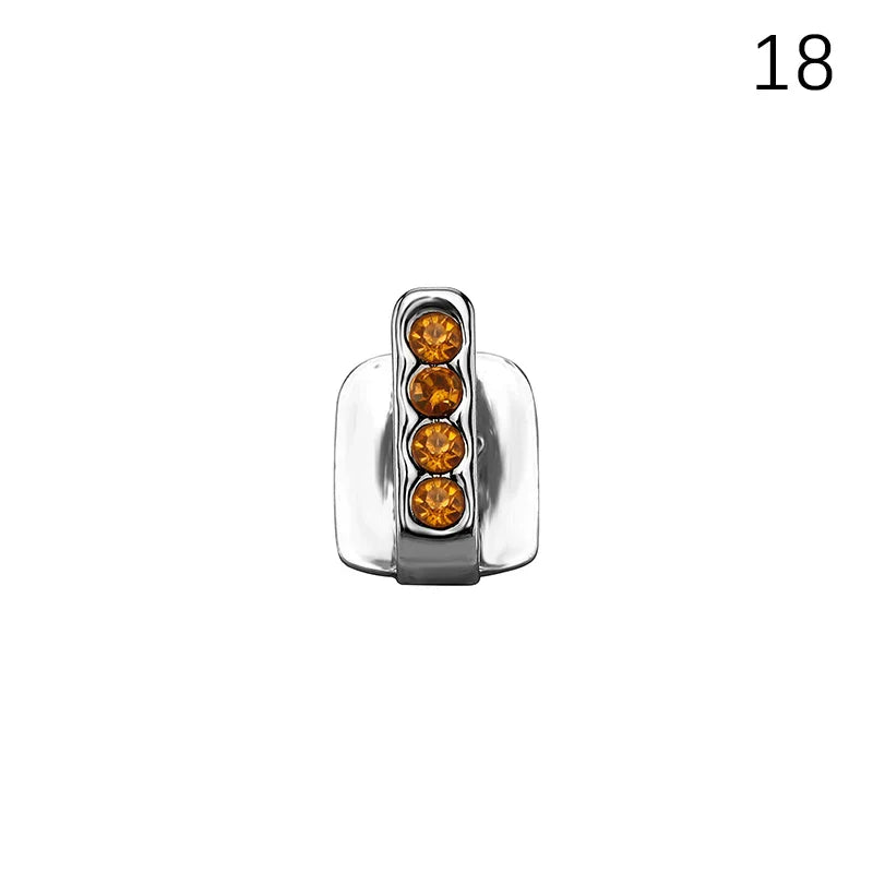 Silver-toned dental grills with four amber gemstones set vertically made from high-quality materials for cosplay and hip hop styles
