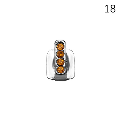 Silver-toned dental grills with four amber gemstones set vertically made from high-quality materials for cosplay and hip hop styles