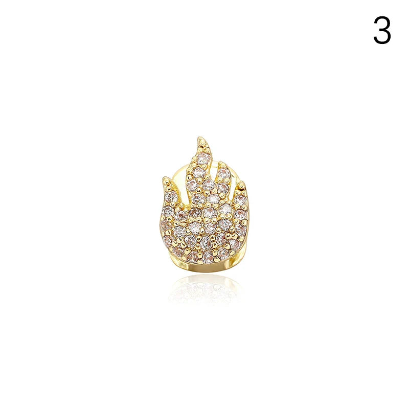 Gold-colored flame-shaped dental grills jewelry adorned with clear cubic zirconia for hip hop and cosplay use