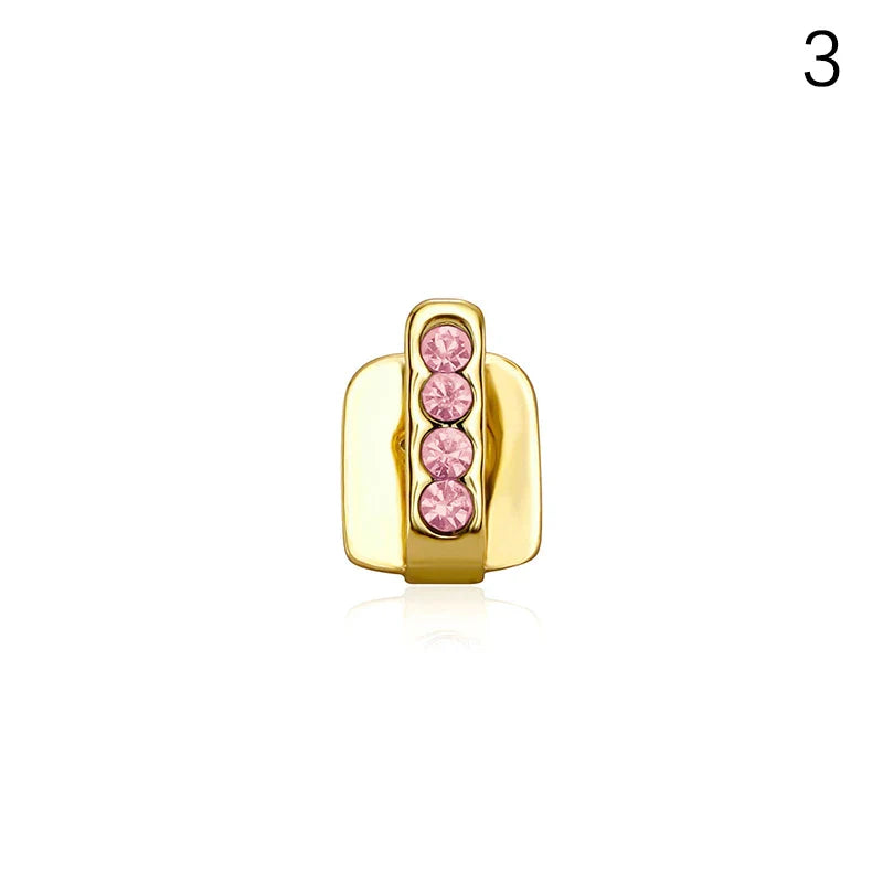 Gold-colored metal dental grills jewelry featuring four vertically aligned pink rhinestones made of high-quality materials