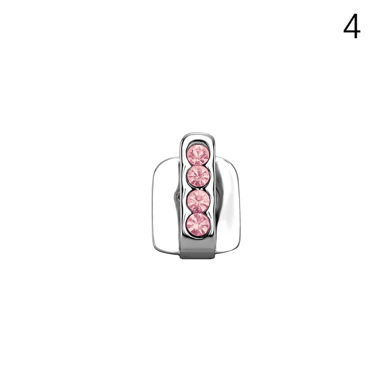 A sleek silver dental grill with four pink rhinestones in a minimalist design for men and women grills jewelry