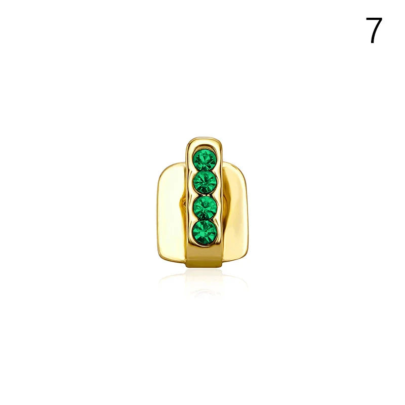 Gold-colored metal dental grills jewelry with four vertically aligned emerald green rhinestones for hip hop style