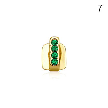Gold-colored metal dental grills jewelry with four vertically aligned emerald green rhinestones for hip hop style