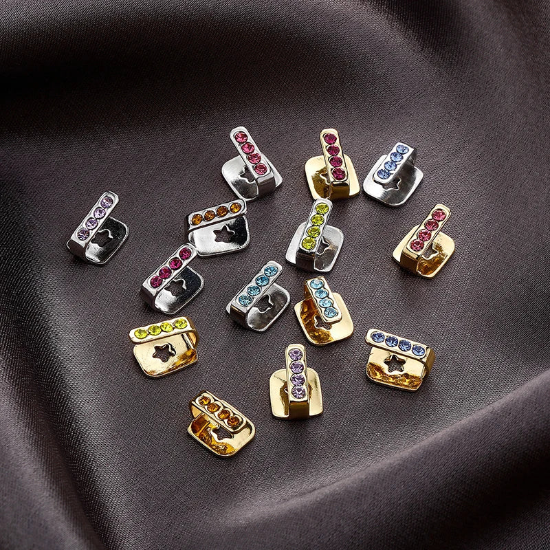 Colorful rhinestone-encrusted silver and gold metal dental grills jewelry with star cutouts for hip hop and cosplay use