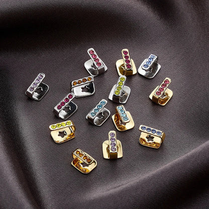 Colorful rhinestone-encrusted silver and gold metal dental grills jewelry with star cutouts for hip hop and cosplay use