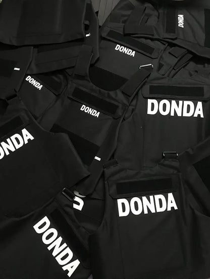 Black tactical hiphop street vest with bold white donda lettering as a strike waistcoat gilet singlet kanyes hiphop outerwear