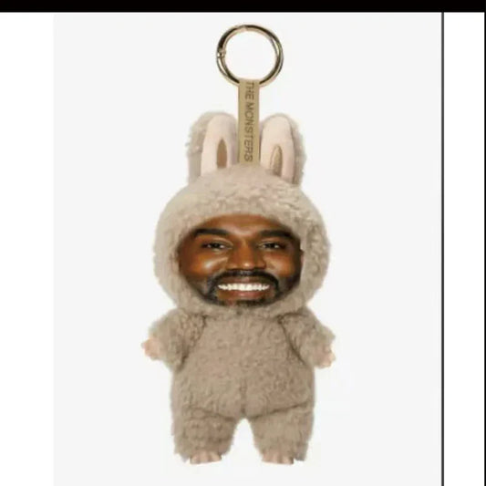 Beige plush bunny keychain with caricatured face and long ears made from soft fuzzy material for kanye west peripheral layeye pendant trending gift