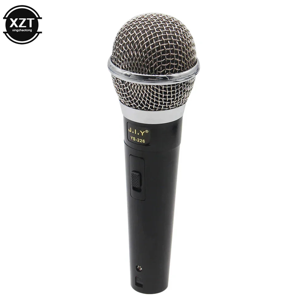 Black handheld professional microphone with silver mesh grille and chrome accents for vocal music performance and karaoke
