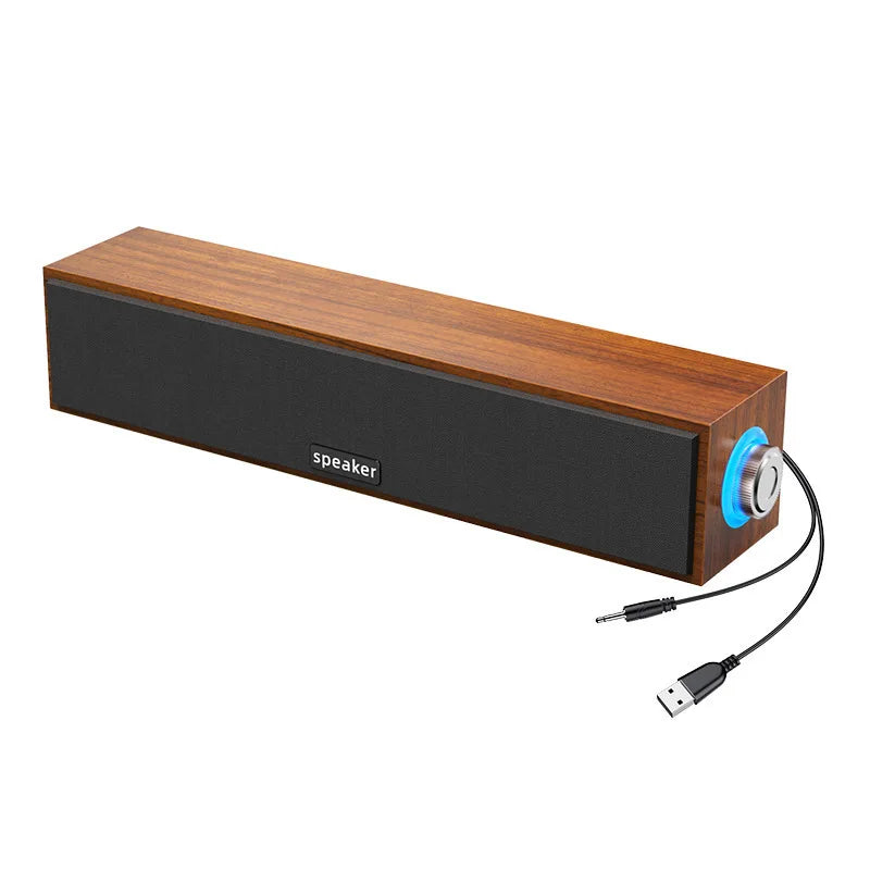Wooden small rectangular speaker with black grille and blue volume knob for desktop computer and notebook use