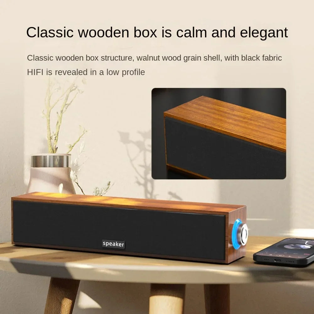 A sleek wired bluetooth dual speaker with walnut wood grain shell and black fabric for computer notebook sound