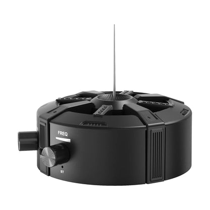 Black circular music box with silver frequency dial and antenna featuring tesla coil bluetooth and aux dual mode features