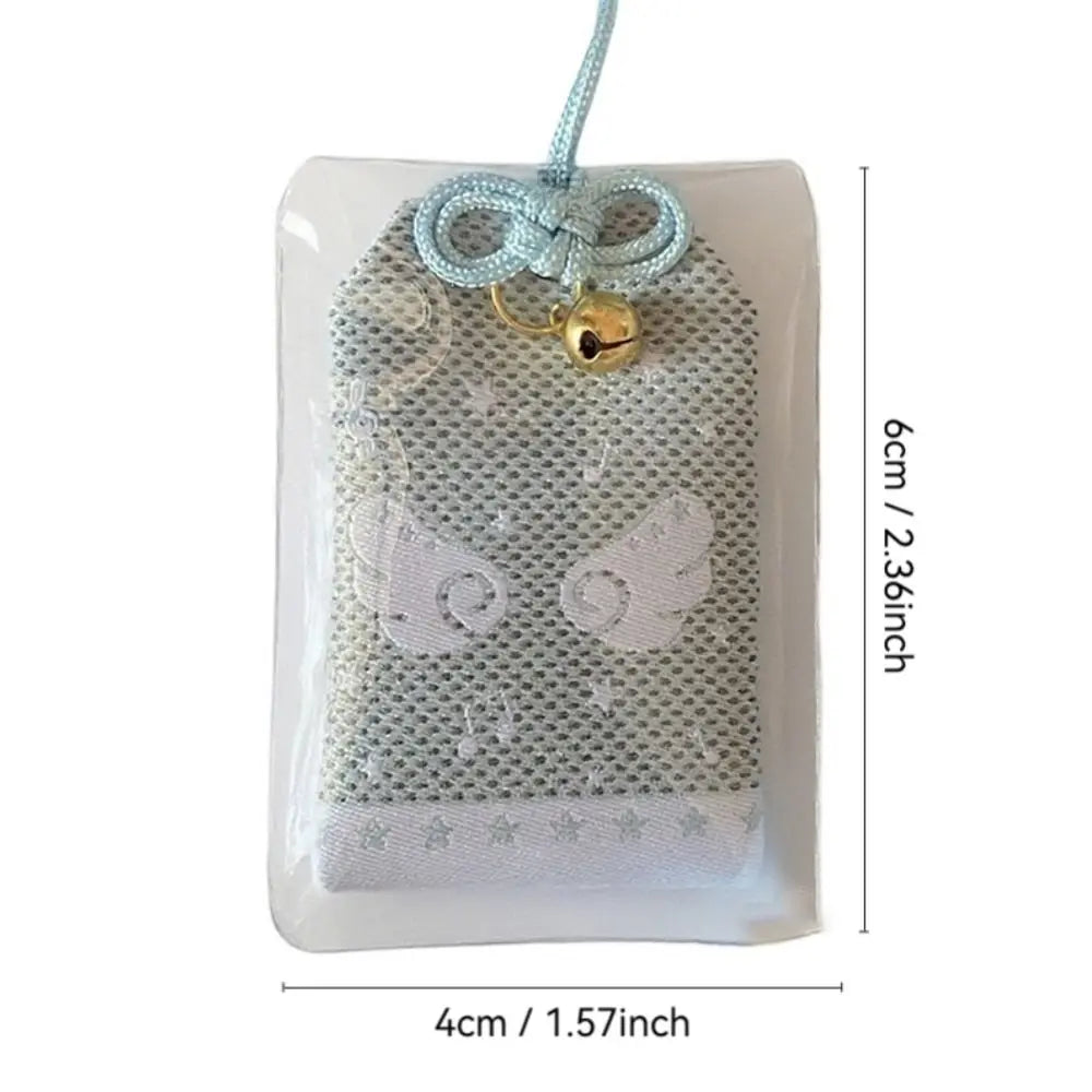 A delicate silver mesh musical notes wings diy embroidery blessings charm with blue cord and golden bell gift keyring key