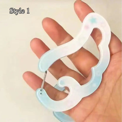 A translucent light blue resin music note keychain with pastel star accents for bags creative bag and phone pendant backpack